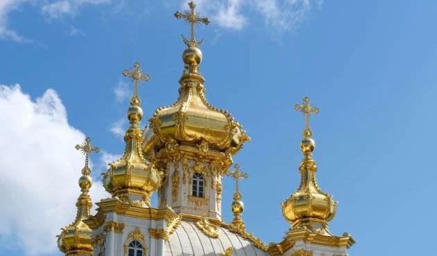 On the opposite side of the palace stands the church, or, as it is also called, the building under the cross.