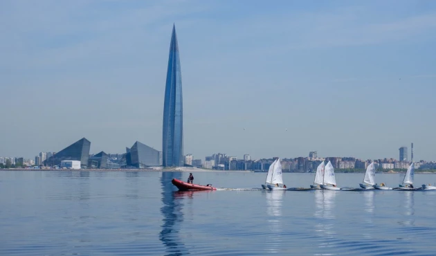 Gazprom Tower and mother duck with young sailors