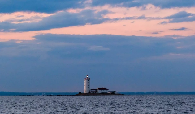The lighthouse is really far away. It stands on the westernmost tip of Kotlin Island.