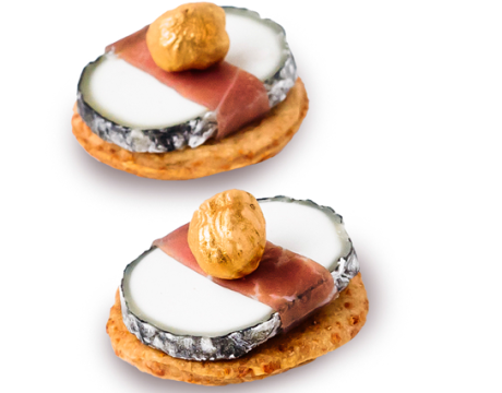 Goat cheese in ash with Bayonne ham and hazelnuts with honey