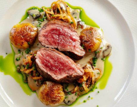 Beef steak with the roasted garlic and mushrooms