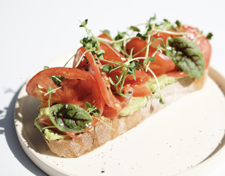 Toast with avocado and tomato slices